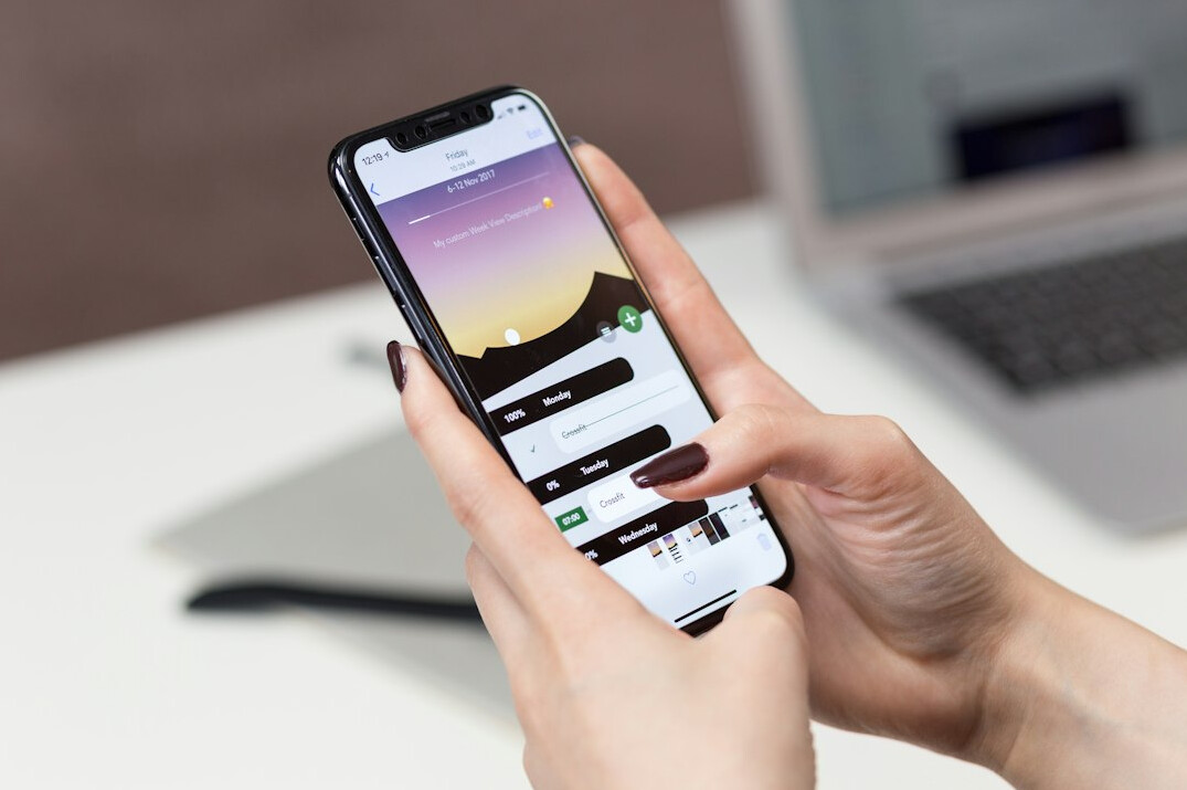 person using smartphone for insurance